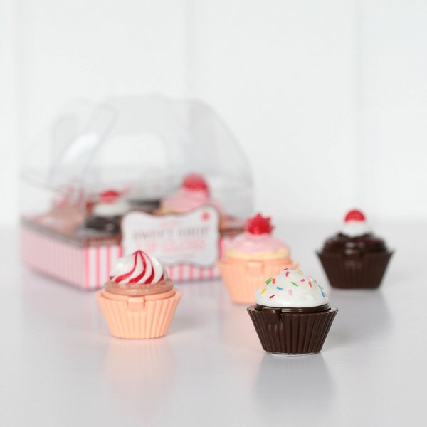 Cupcake lip gloss on table