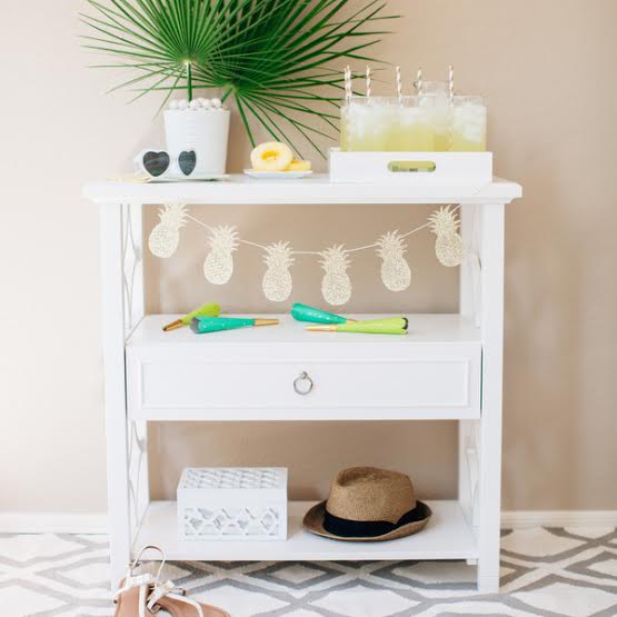 Serving table decorated for luau party